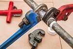 Using a wrench on plumbing pipes