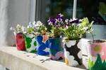 Pretty flower pots made from upcycling of tin cans