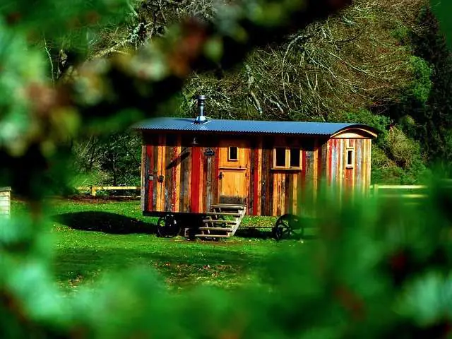 Tiny house from recycled materials in the woods