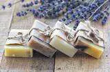 handmade soaps in natural colors above a wooden table